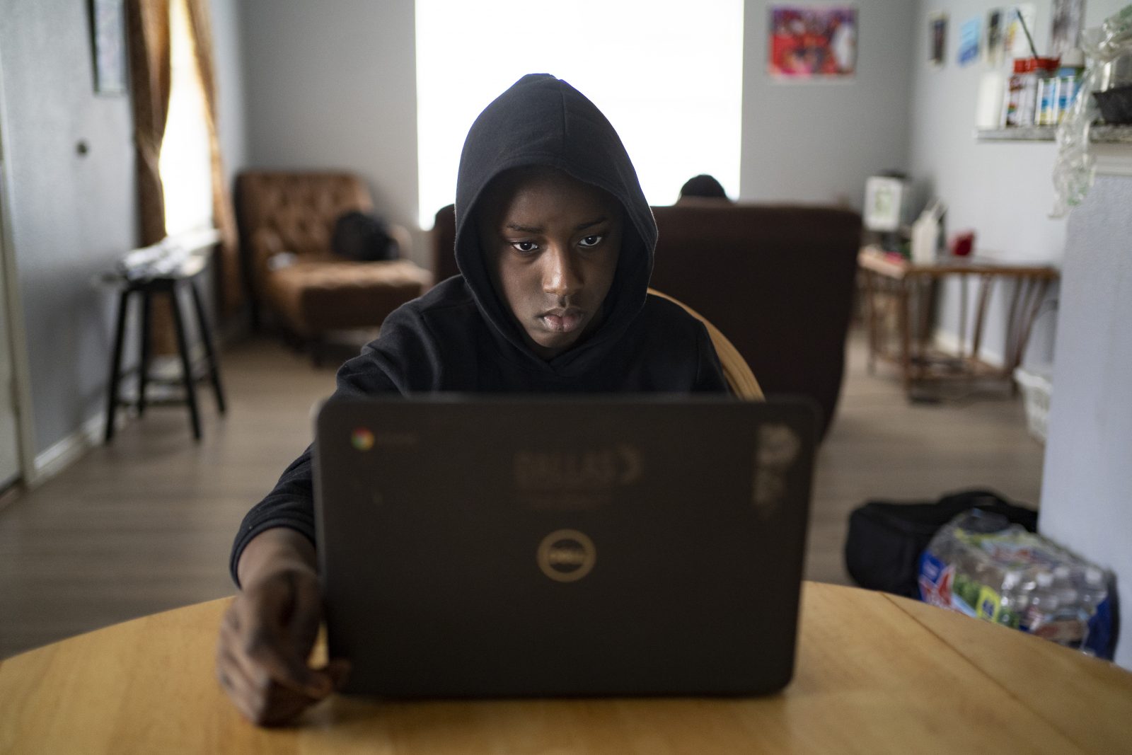 TeQuan Showers, a fifth-grader at Charles Rice Learning Center in South Dallas, couldn't attend school virtually because of internet connection issues until Dallas ISD equipped his family with technology to access a new wireless network. Photo by Nitashia Johnson